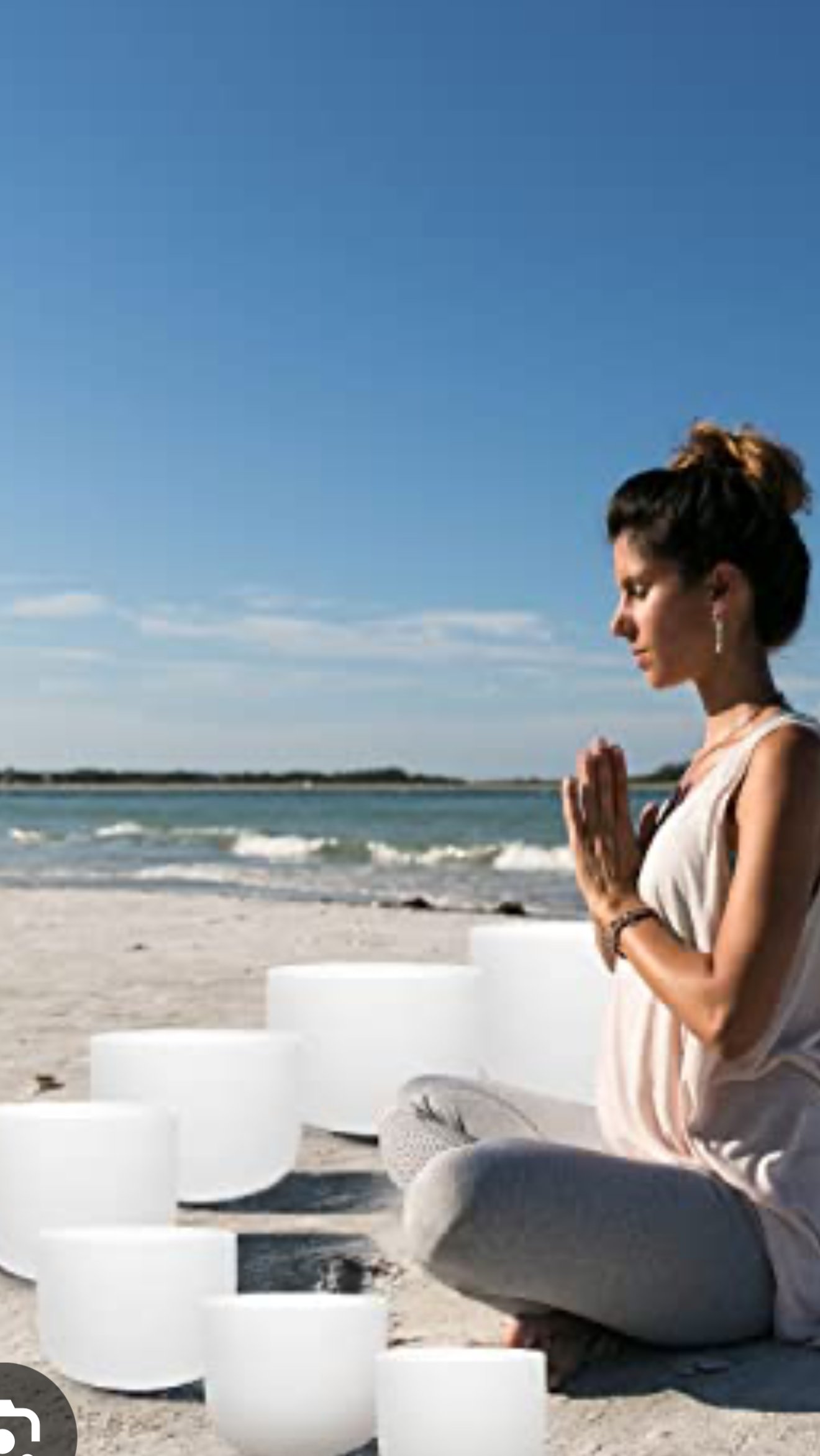 Peaceful meditation by the water, representing Jennifer's spiritual approach